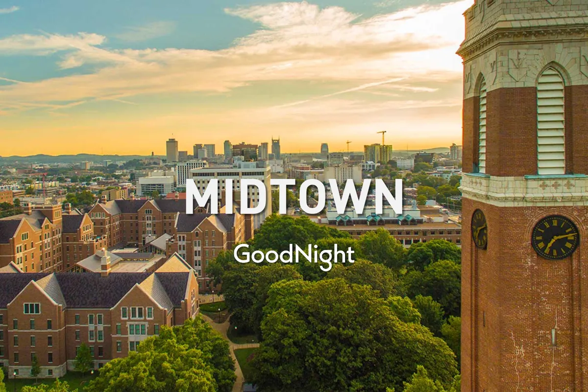 A scenic view of the city skyline framed by historical buildings, a prominent clock tower, and lush greenery. The image captures the serene ambiance of evening strolls and urban exploration.