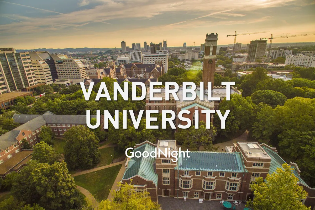 A panoramic view featuring the Vanderbilt University clock tower surrounded by historic buildings and lush greenery, offering a serene snapshot of the urban campus landscape within walking distance of the property.